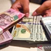 Rupiah Ditutup Melemah ke Rp18.156 per Dolar AS, Pasar Cermati Konflik Iran